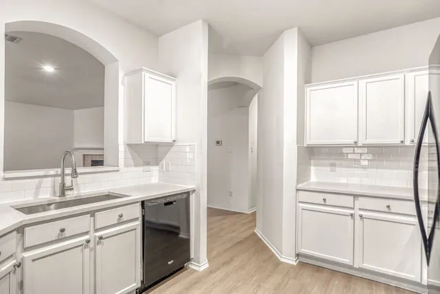 a bathroom with a double vanity sink and mirror