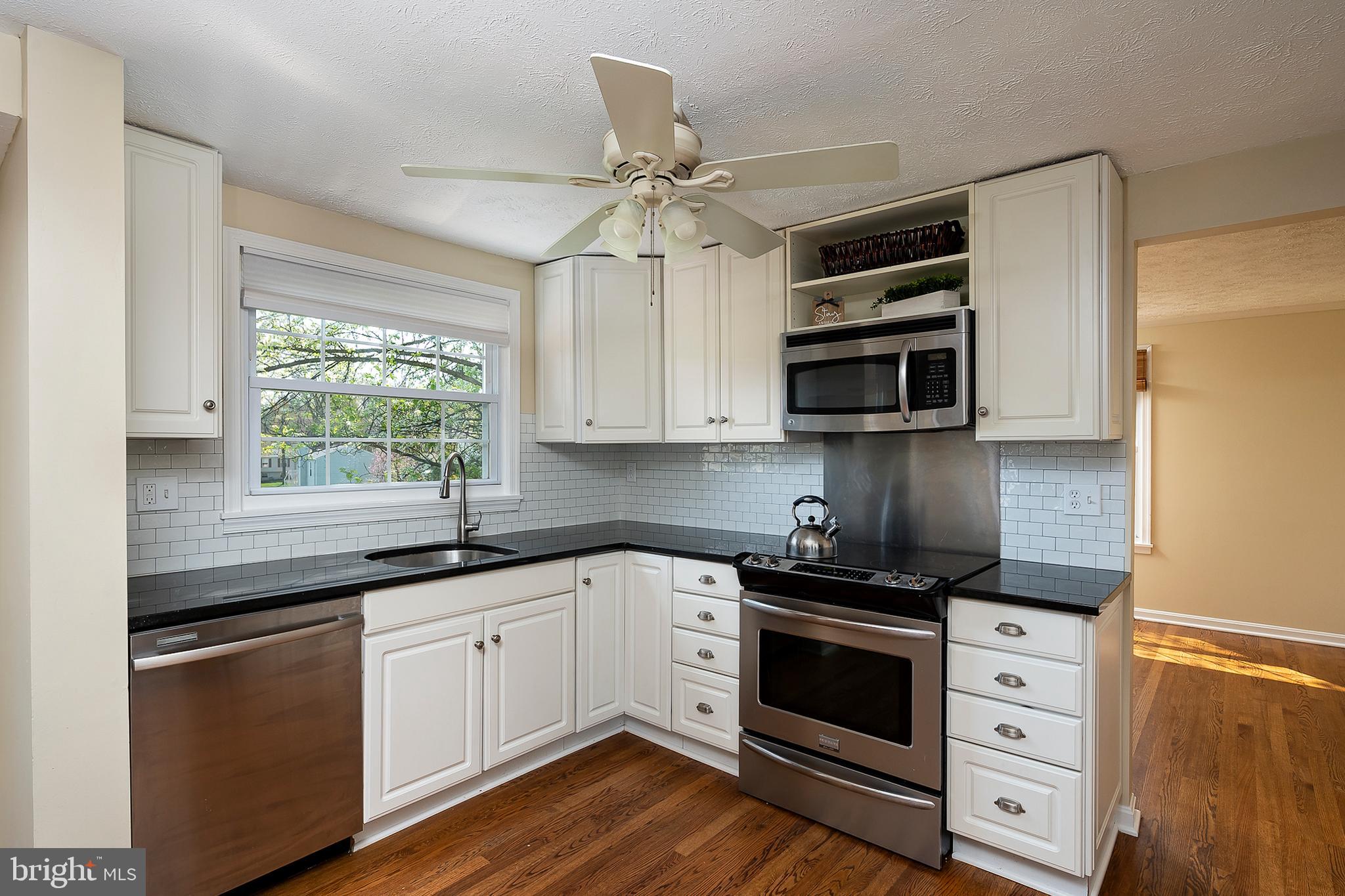 6406 Lookinglass Lane Columbia, MD 21045 - Photo 13 of 41 Featuring glistening granite countertops