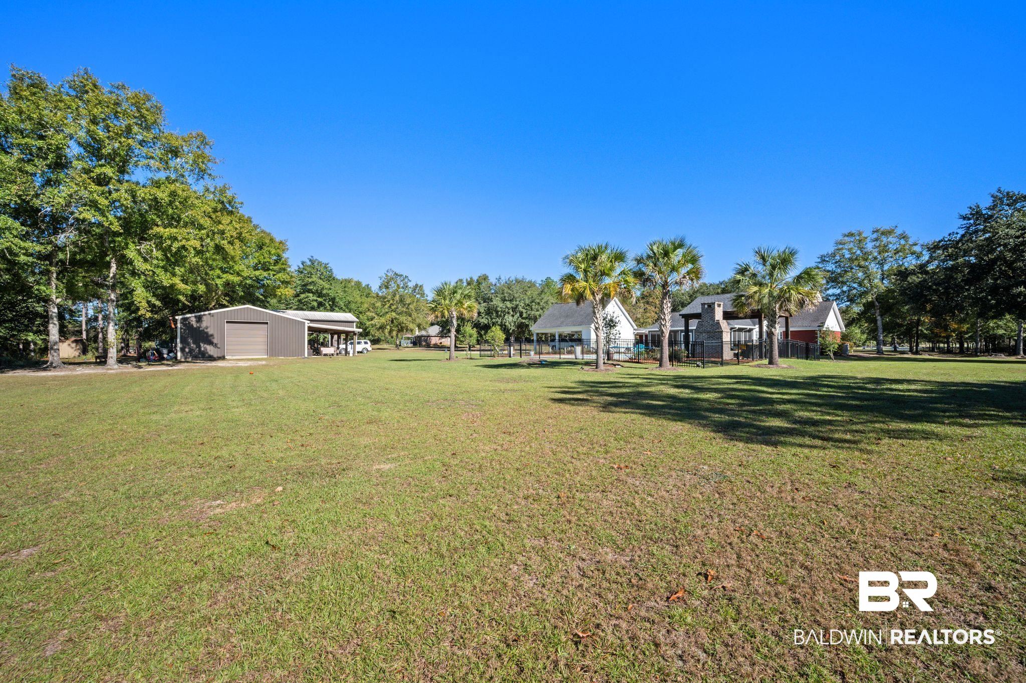38211-d) V R Byrd Road Bay Minette, AL 36507 - Photo 43 of 58 View of yard featuring an outbuilding, a carport, and a garage