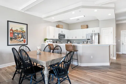 a view of a dining room with furniture and wooden floor