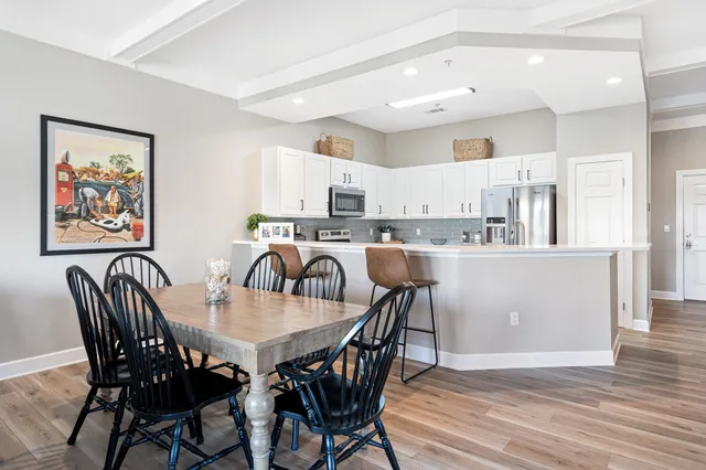 a view of a dining room with furniture and wooden floor