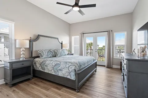 a bedroom with a large bed and a large window