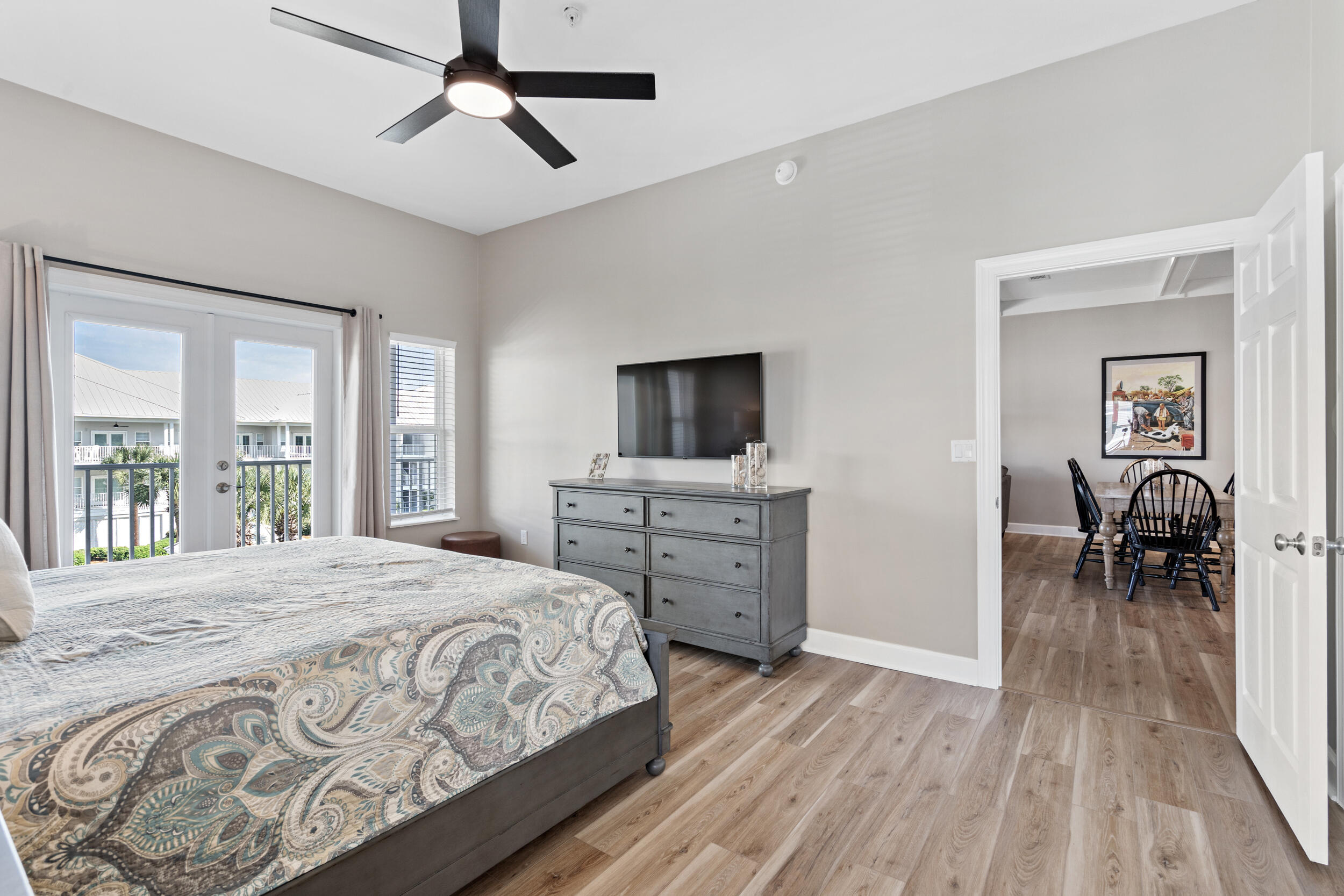 2410 Scenic Gulf Drive, Unit 201C Miramar Beach, FL 32550 - Photo 19 of 39 a bedroom with a bed and a flat tv screen on dresser