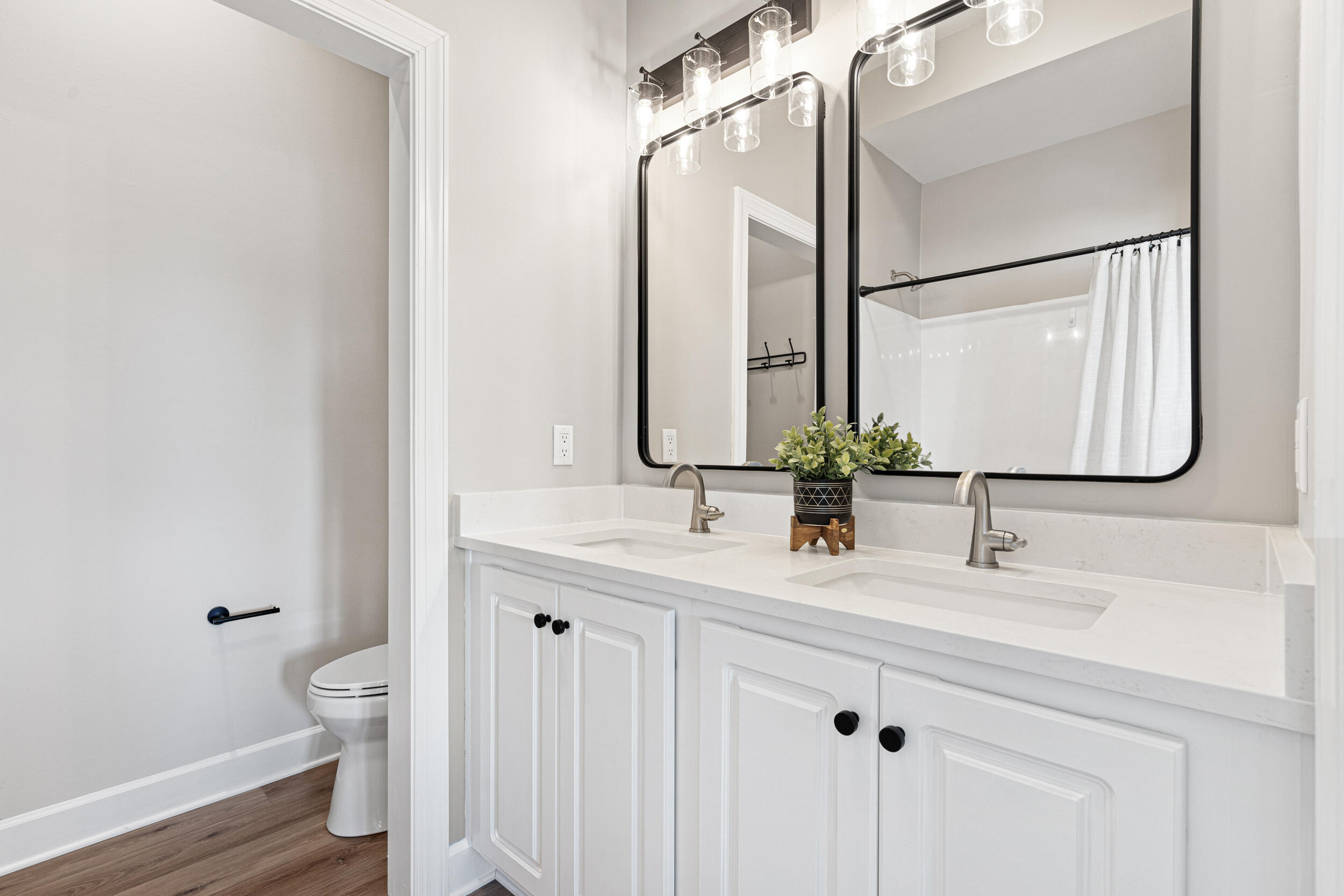 2410 Scenic Gulf Drive, Unit 201C Miramar Beach, FL 32550 - Photo 20 of 39 a bathroom with a double vanity sink and a mirror