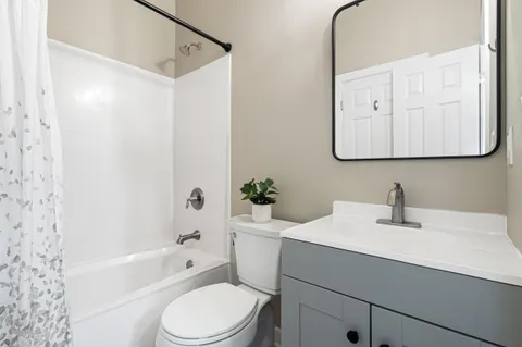 a bathroom with a sink toilet and bathtub