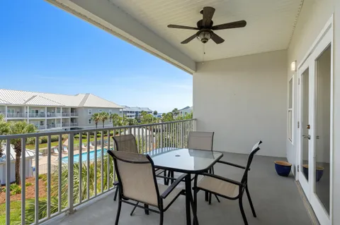 a view of a balcony with furniture