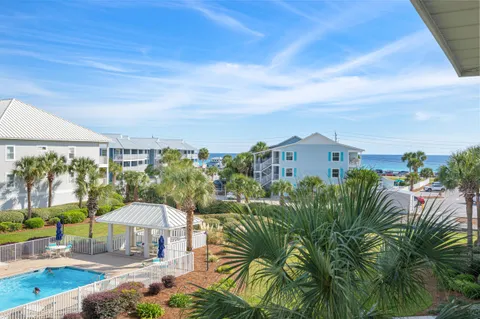 a view of a chairs and table in patio
