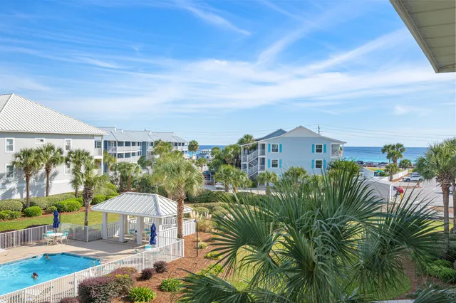 a view of a chairs and table in patio