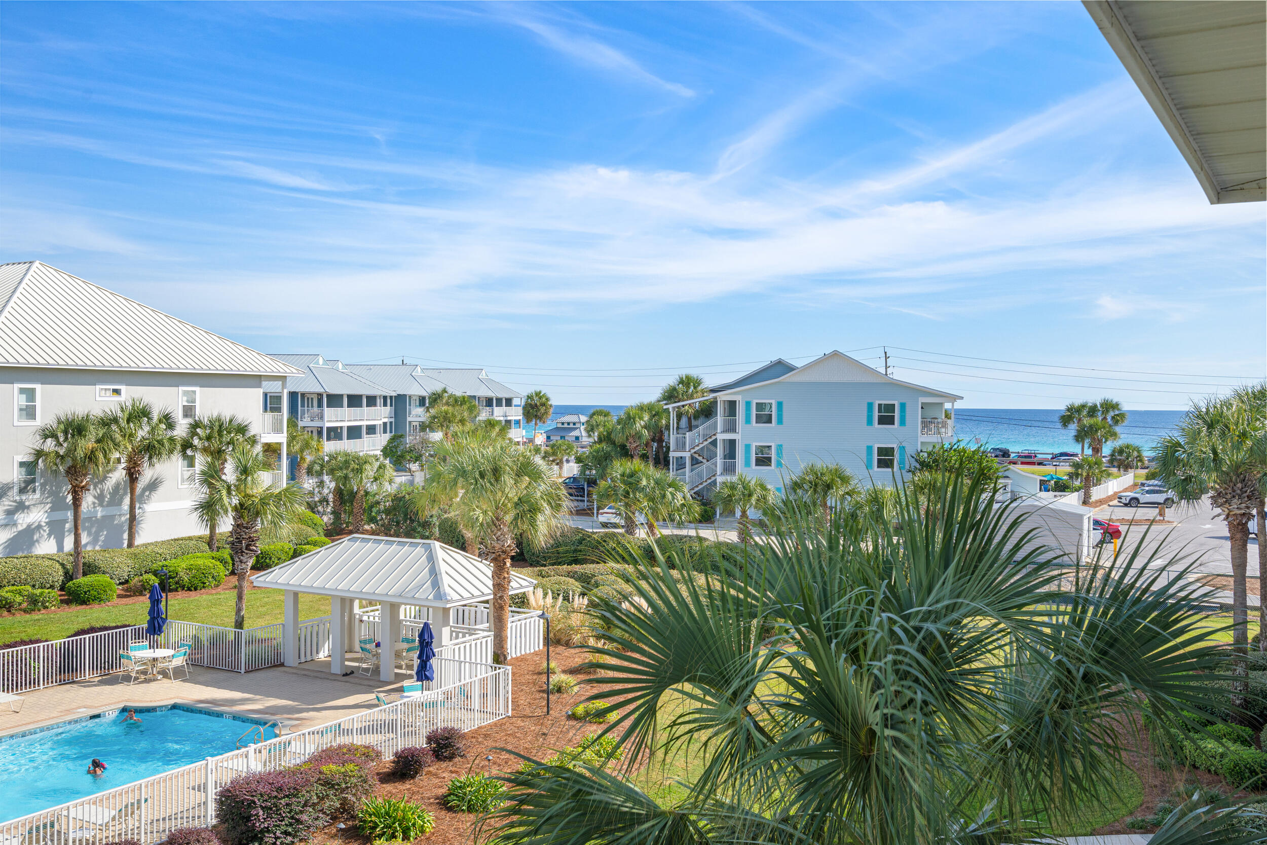 2410 Scenic Gulf Drive, Unit 201C Miramar Beach, FL 32550 - Photo 29 of 39 a view of a chairs and table in patio