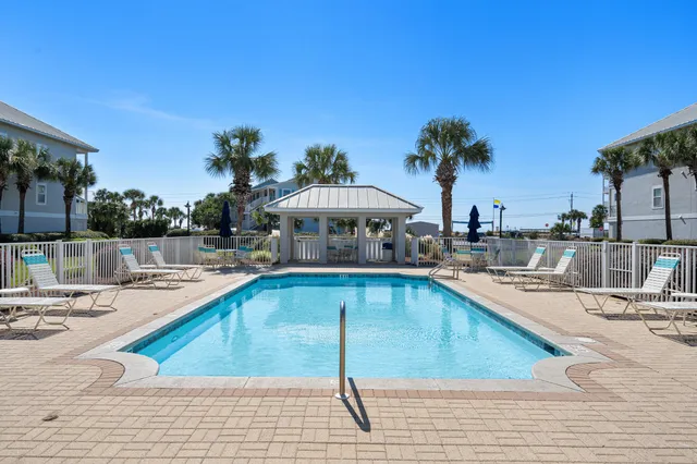 a view of a swimming pool with a lounge chairs