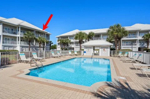 a swimming pool with outdoor seating