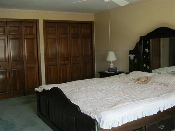 7 Wilder Road Sterling, MA 01564 - Photo 15 of 25 a bedroom with a bed and a closet