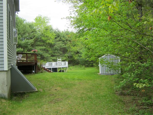 7 Wilder Road Sterling, MA 01564 - Photo 3 of 25 a view of a house with a backyard