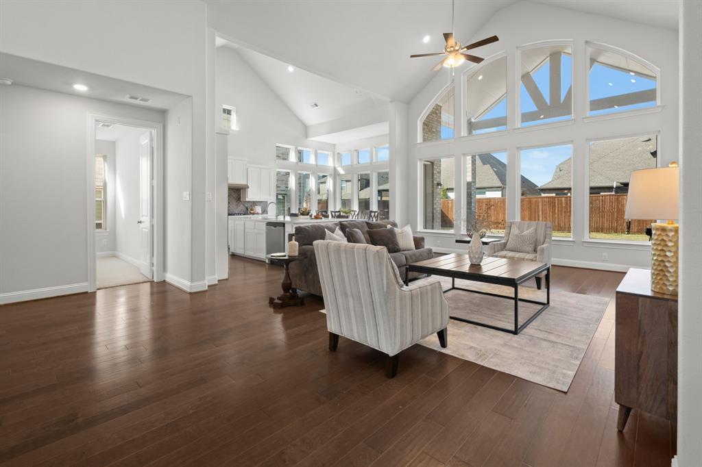 1320 Cartona Road Fate, TX 75087 - Photo 7 of 35 Vaulted Cathedral Style ceiling, Luxury vinyl wood-finish flooring, piucture window, and recessed lighting