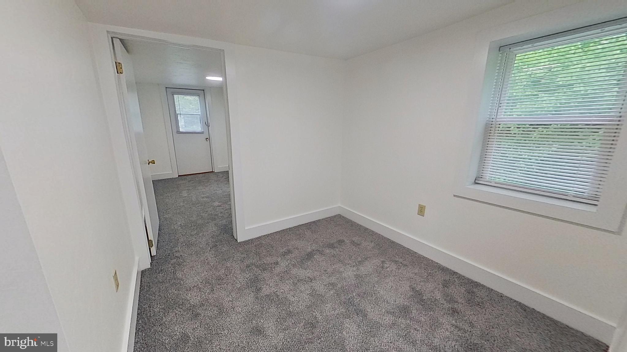 5271 Nursery Road Dover, PA 17315 - Photo 14 of 14 an empty room with a window and a bathroom