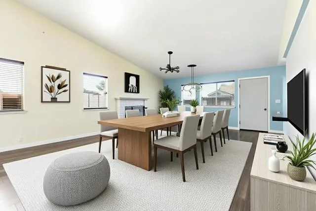 a view of a livingroom with furniture and a potted plant