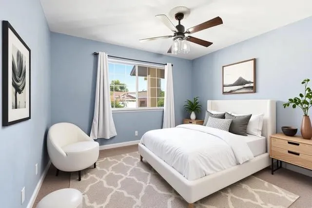 a bedroom with a large bed and a window