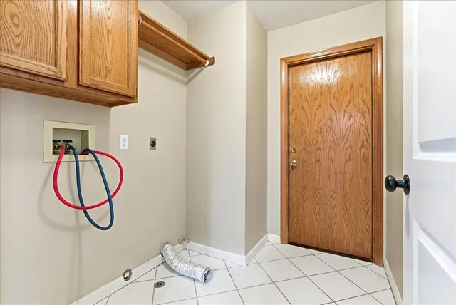 a view of a room with rack on the wall and a window