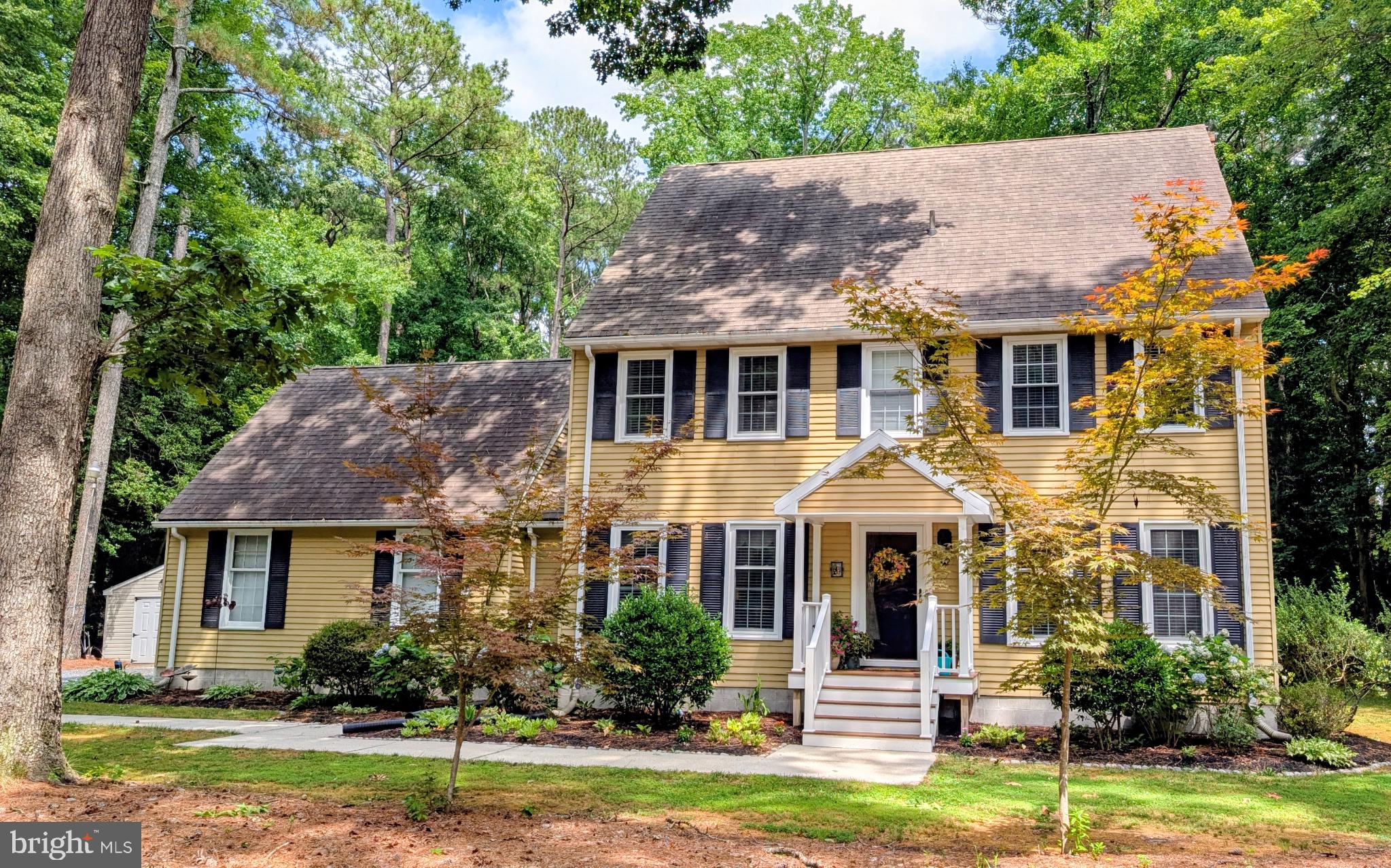 7301 Topaz Court Hebron, MD 21830 - Photo 38 of 47 Charming yellow home in lush greenery.