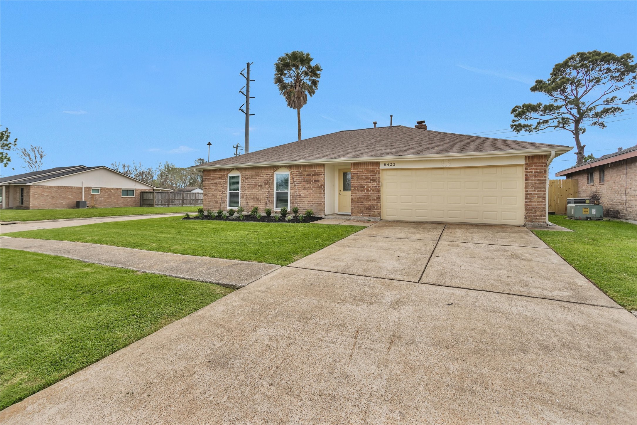 8422 Oakhaven Road La Porte, TX 77571 - Photo 2 of 46 Extended driveway leading to a two-car attached garage offering convenient parking and storage.