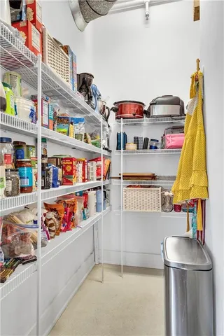 a kitchen with lots of clutter and cabinets