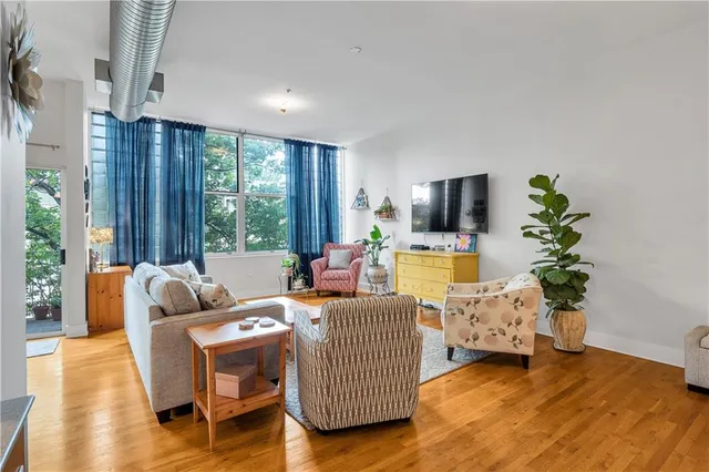 a living room with furniture and a flat screen tv