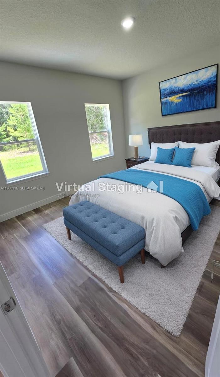 16855 Southwest 18th Avenue Road, Unit 16855 Ocala, FL 34473 - Photo 15 of 16 a bedroom with a bed and a window