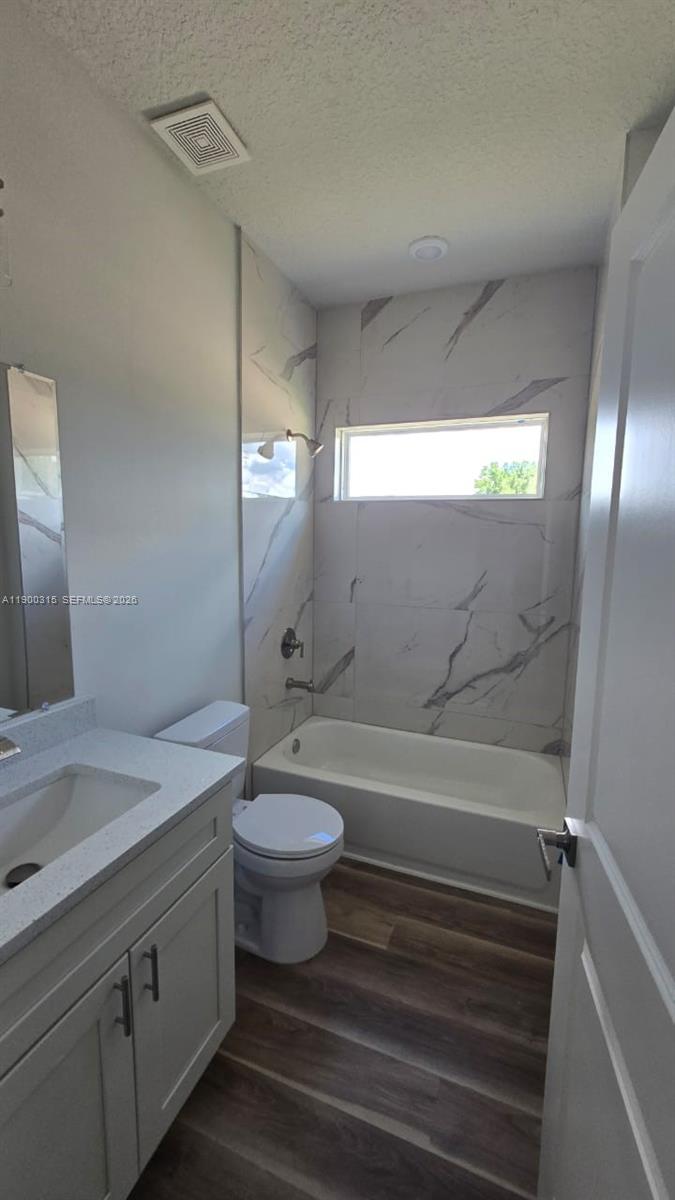 16855 Southwest 18th Avenue Road, Unit 16855 Ocala, FL 34473 - Photo 5 of 16 a bathroom with a sink a toilet and shower