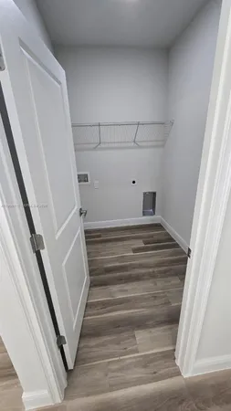 a spacious bathroom with a tub sink and mirror