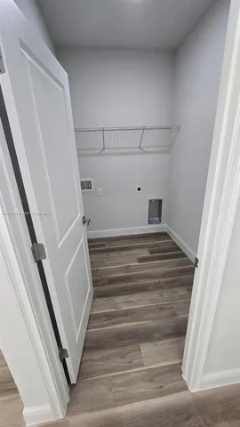 a spacious bathroom with a tub sink and mirror