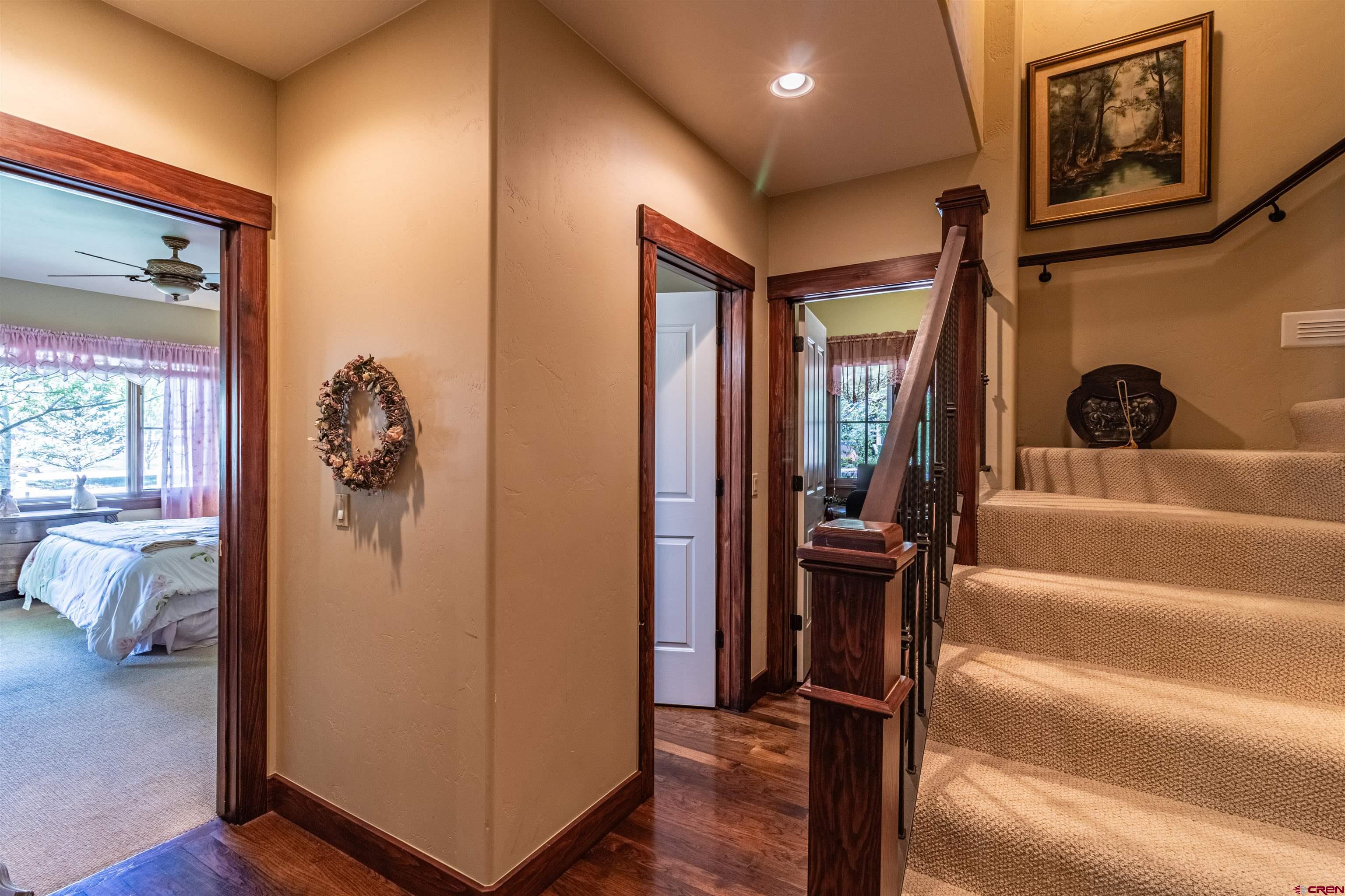1167 North Dalton Ranch Road Durango, CO 81301 - Photo 28 of 45 a view of hallway with stairs and wooden floor