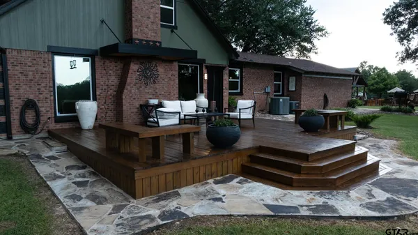 a view of a backyard with sitting area