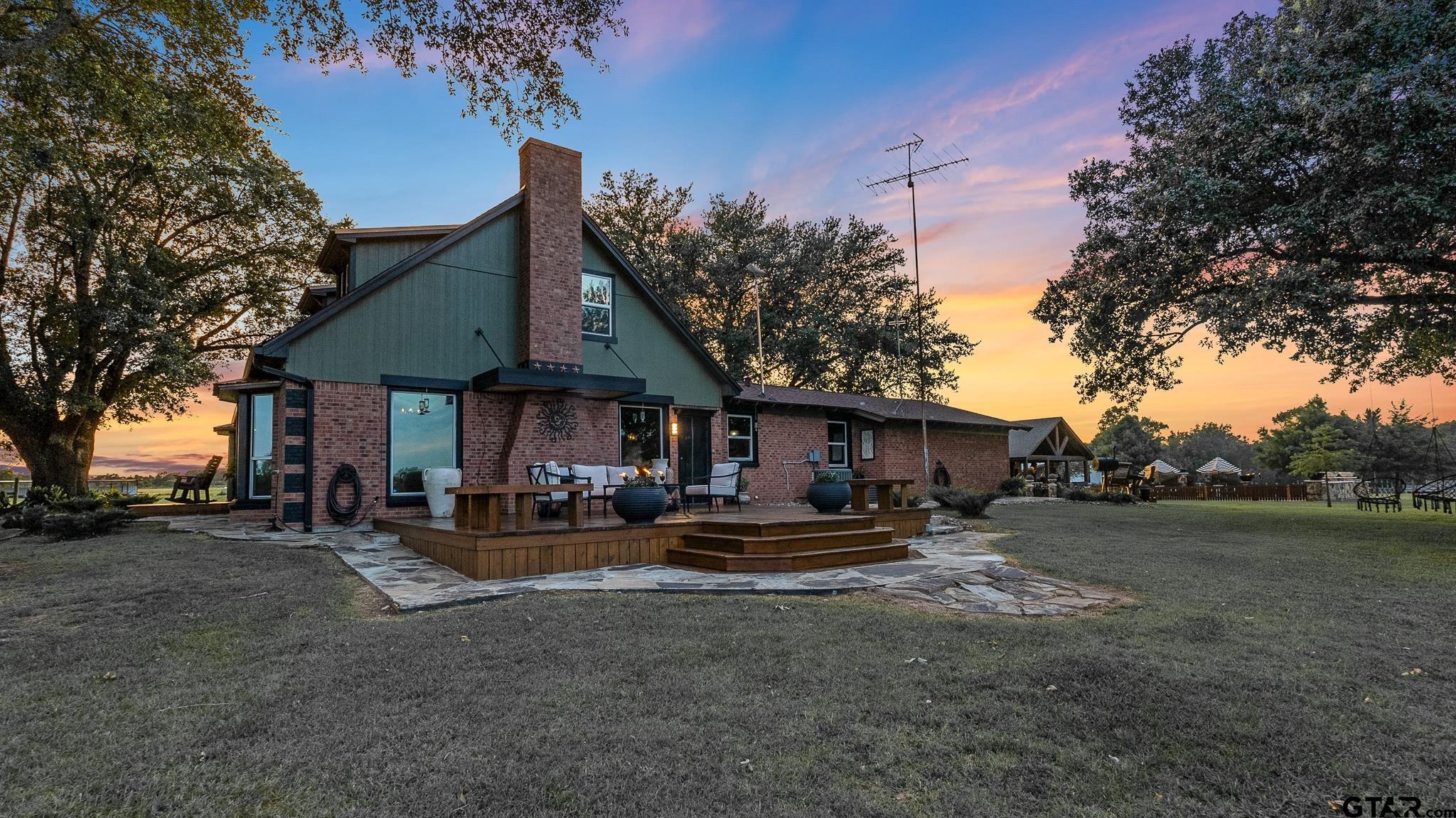 668 County Road 108 Carthage, TX 75633 - Photo 14 of 42 a view of a house with backyard