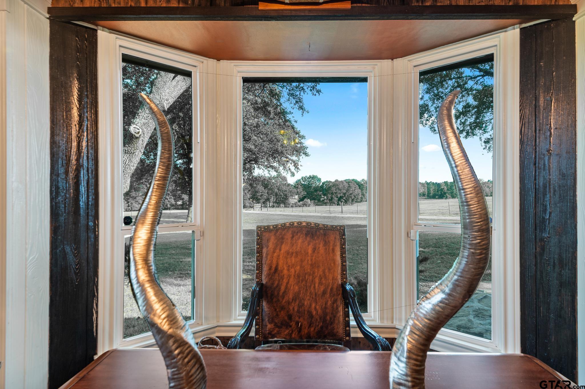 668 County Road 108 Carthage, TX 75633 - Photo 19 of 42 a view of a entryway door with wooden floor