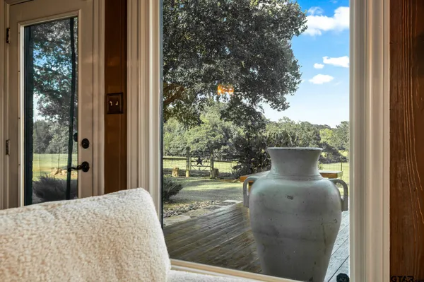 a view of balcony and yard