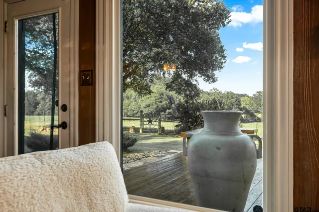 a view of balcony and yard