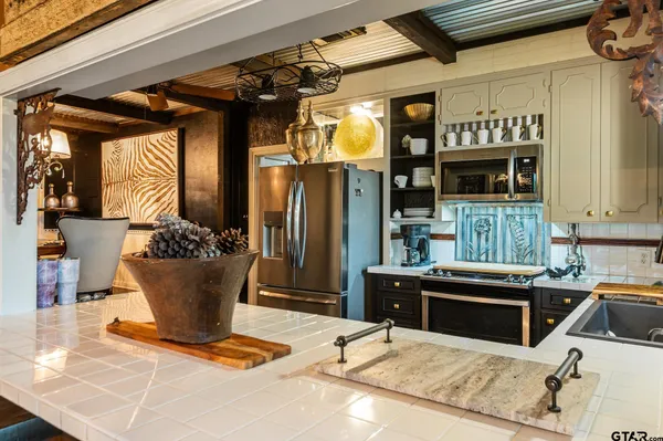 a kitchen with a appliances and cabinets