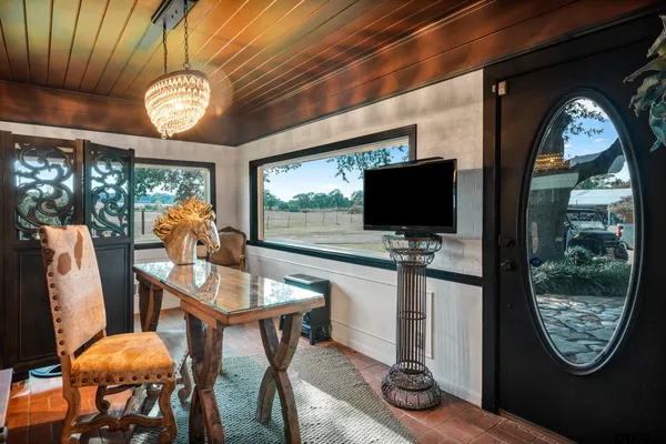 a view of a livingroom with furniture window and outside view