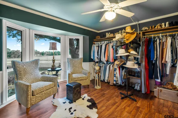 a living room with furniture or wooden floor and a chandelier