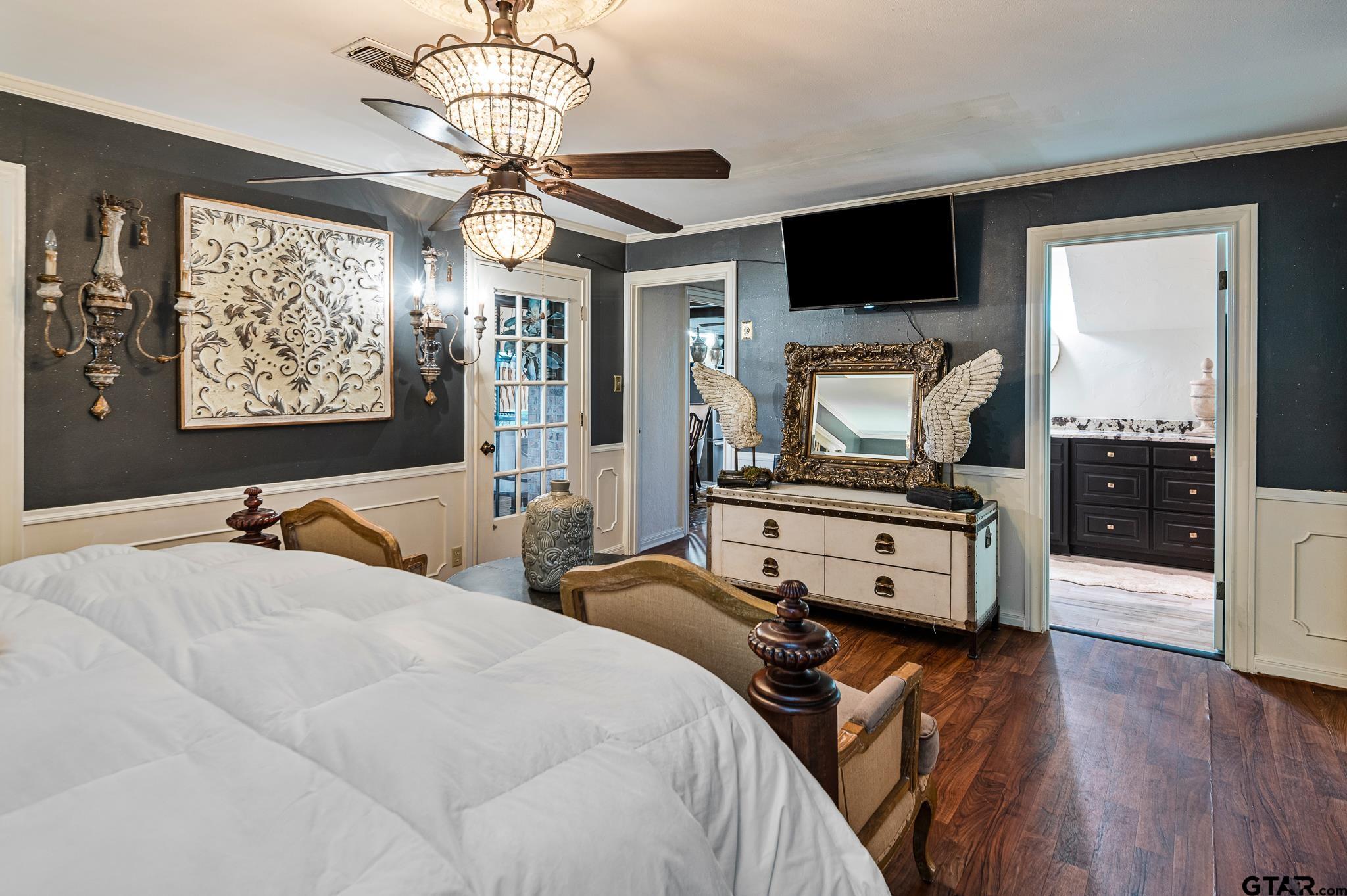 668 County Road 108 Carthage, TX 75633 - Photo 28 of 42 a bedroom with a bed and a flat screen tv