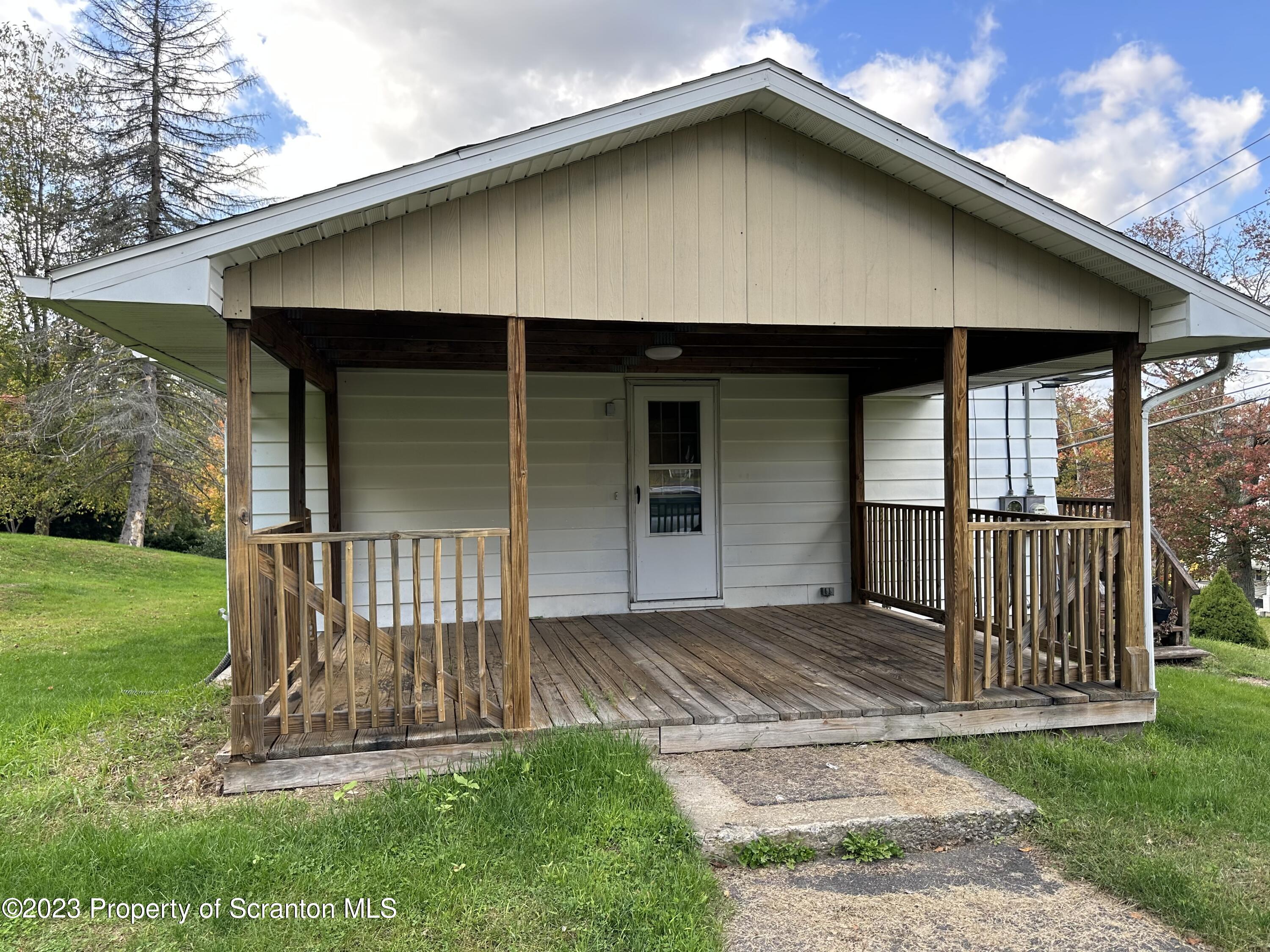 514 Morse Avenue Simpson, PA 18407 - Photo 2 of 9 a front view of a house with a yard