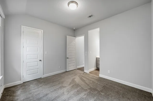 a bathroom with a tub shower sink vanity and mirror
