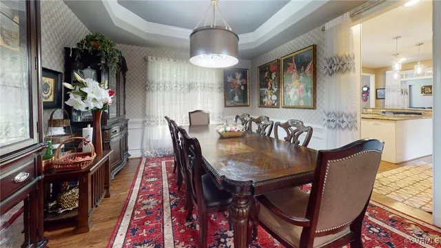 a dining room with furniture and window