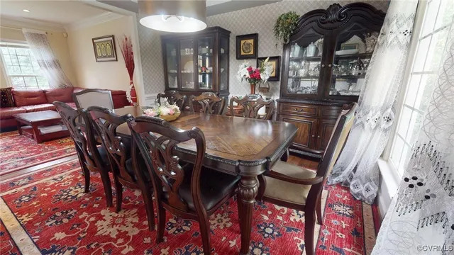 a view of a dining room with furniture and window