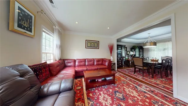 a living room with furniture or couch and a rug