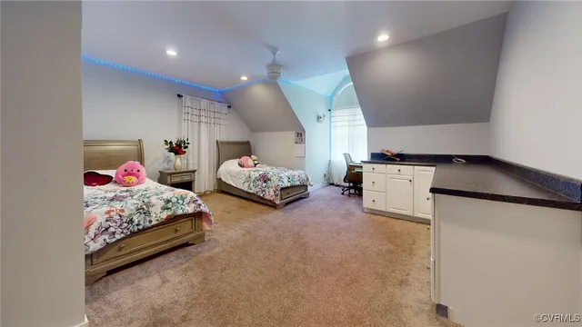 a view of a kitchen with a sink and a refrigerator