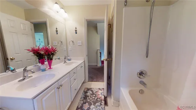 a large bed sitting in a bedroom next to a window