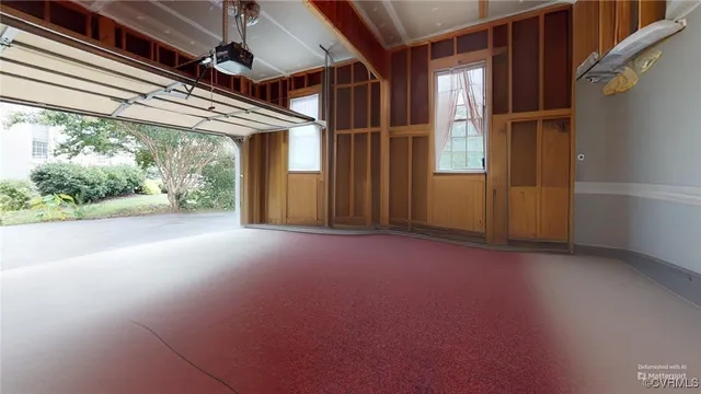 a view of an empty room with a kitchen