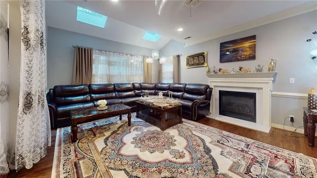 a living room with furniture windows and a fireplace