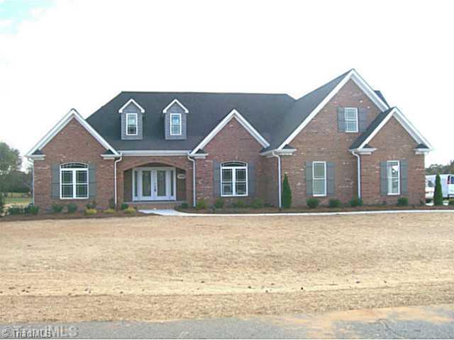 5628 Cape Fox Drive Oak Ridge, NC 27310 - Photo 1 of 16 Exterior Front. Custom detail and features set off this home in the heart of Oak Ridge. 1.3 acre lot, 3 car garage.